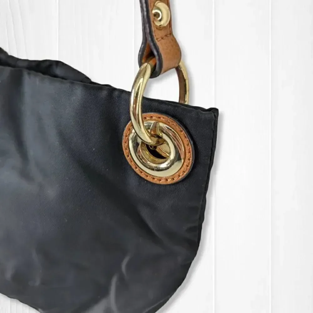 Vince Camuto Womens Sling Bag Adjustable Strap Tasseled Black and Brown